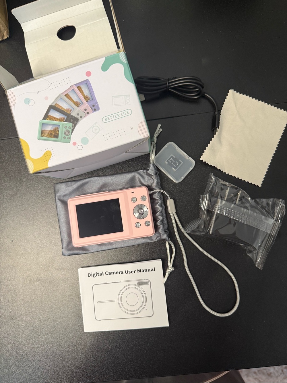 Pink Point-and-Shoot Digital Camera with Accessories